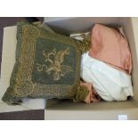 A box of curtains and cushions plus a gilt wall mirror