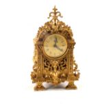 A gilt metal mantel clock (later movement)