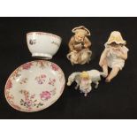 A Newhall tea bowl and saucer (saucer cracked) plus three porcelain figures