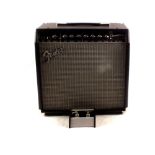 A boxed Fender Champion 40 amplifier plus a Fender Mustang two button foot switch,