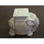 A cream glazed elephant garden seat