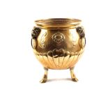 A large 19th Century bulbous brass jardiniere with embossed and gadrooned decoration three rams