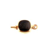 A 10ct gold watch key set with onyx stone,