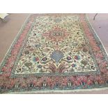 A Persian cream ground floral carpet,
