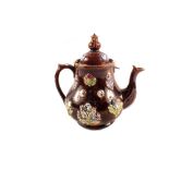 A Victorian Bargeware teapot inscribed 'Like It Good' (repaired finial)