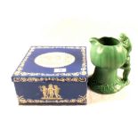 A green Sylvac pixie jug plus Huntley and Palmers biscuit tin