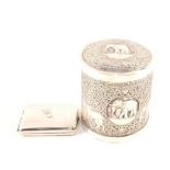 A silver match case plus an Indian white metal lidded box with elephant decoration