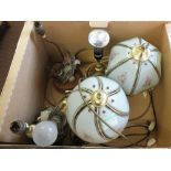 A box of various table lamps