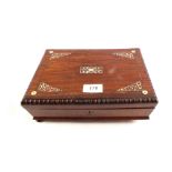 A 19th Century rosewood and mother of pearl inlaid games box with mother of pearl inlaid crib board,