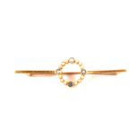 A 15ct gold bar brooch set with blue stone and seed pearls (one missing)