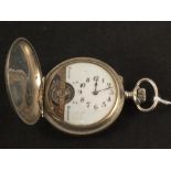 A gents Heboomas 8 day pocket watch with open escapement in lion and Arab horse and rider chased
