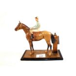 A cold painted horse and jockey cigarette lighter