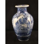 A Japanese blue and white figure and floral vase