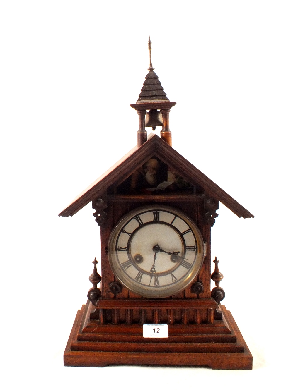 A German steeple clock with ornamental bell