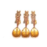 Three unusual mixed metal Egyptian condiment spoons depicting an Egyptian God