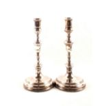 A pair of silver candlesticks,