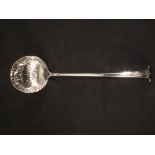 A Robert Sharp silver ladle with shell shaped bowl