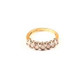 An 18ct gold seven stone diamond ring,