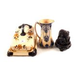 A Victorian cheese dish plus a group of elephants on wooden stand