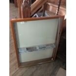 A wall hanging glazed display cabinet