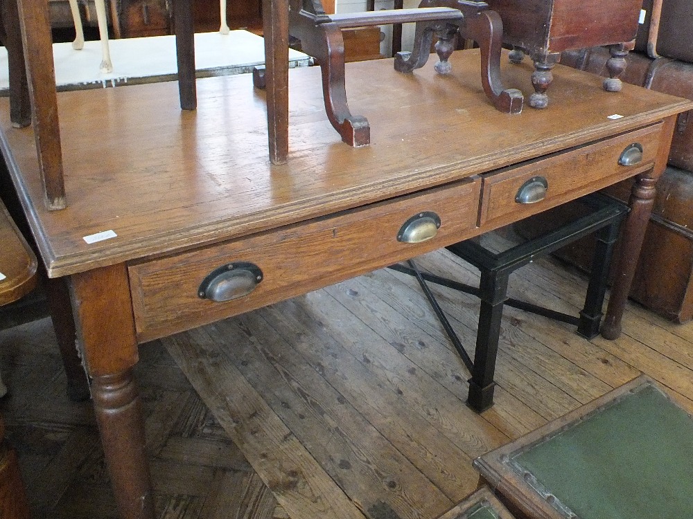 An oak two drawer office table