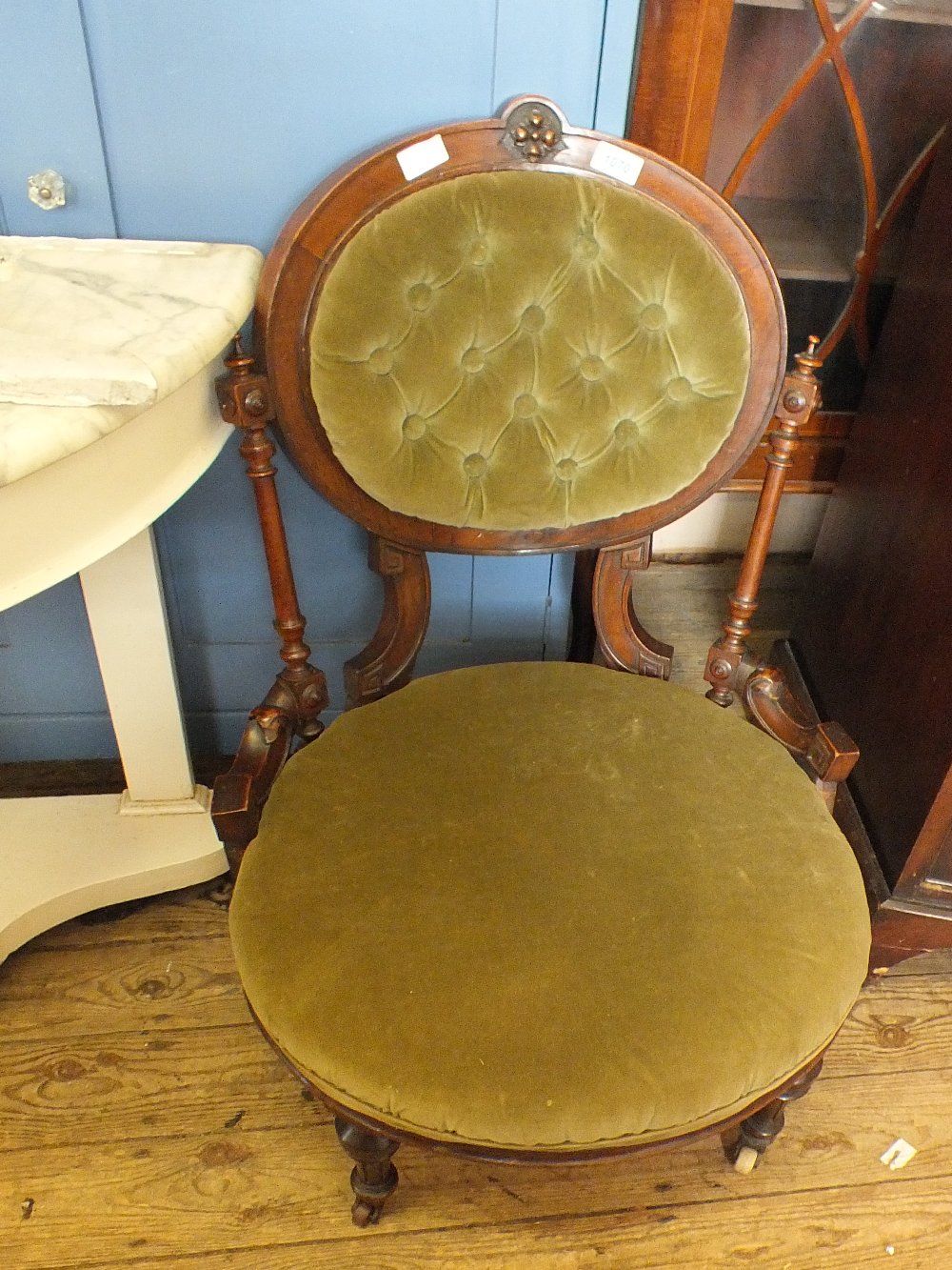 A Victorian mahogany lady's chair with green draylon upholstery