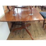 A Victorian mahogany pedestal dining table