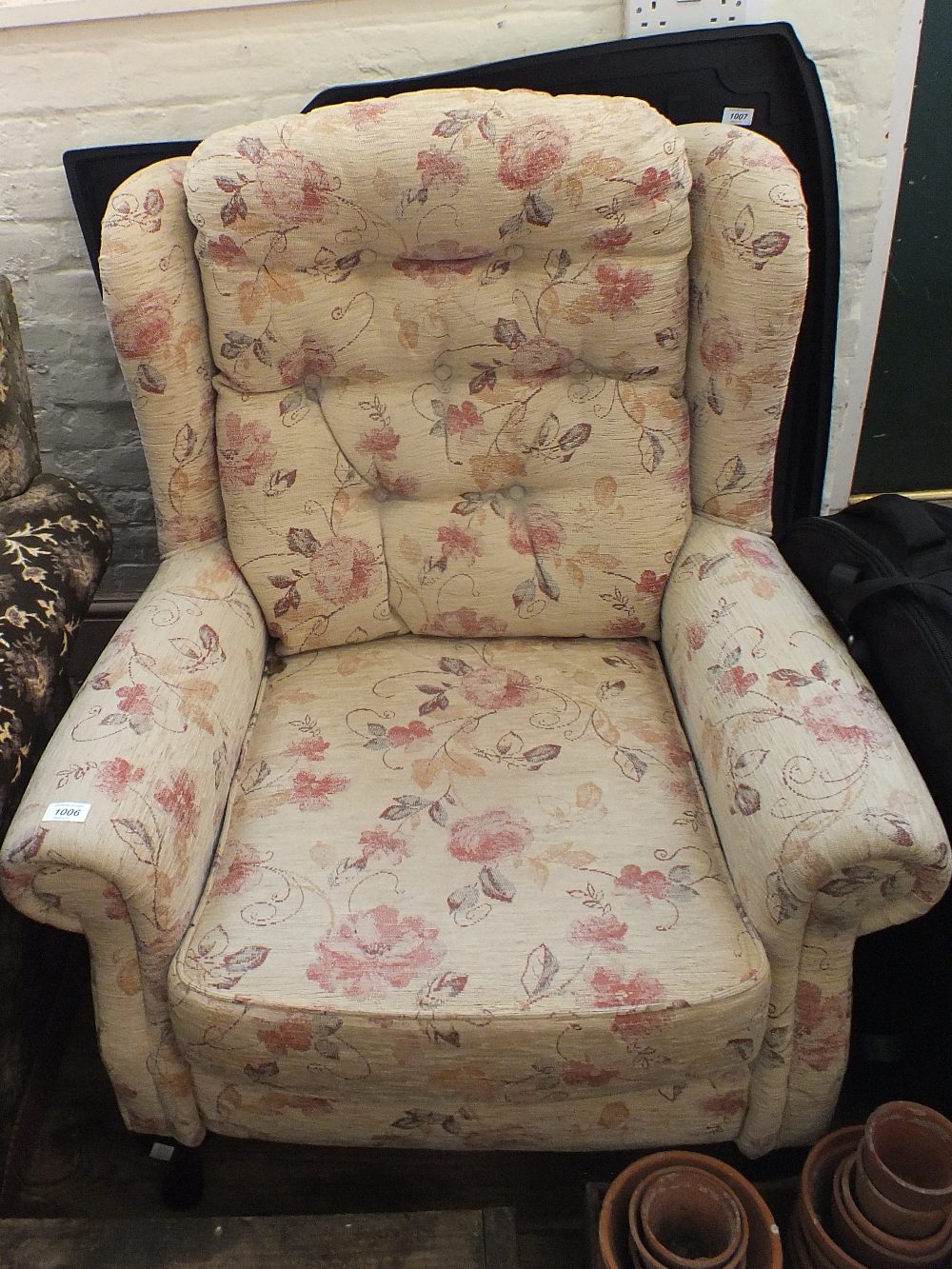A modern floral upholstered armchair