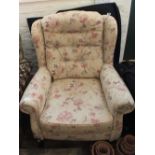 A modern floral upholstered armchair