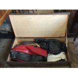 A blanket box and contents including tennis rackets,