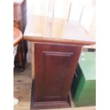 A mahogany pedestal shelved cupboard