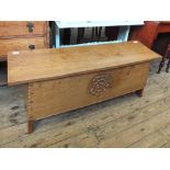 A carved light oak blanket chest by Jack Grimble of Cromer