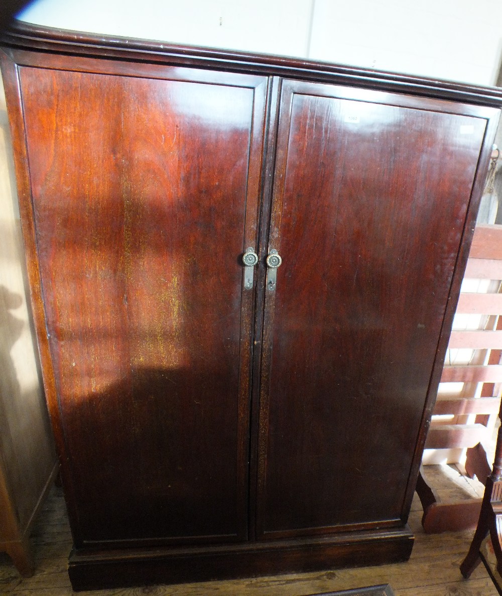 A mahogany two door compendium by Compactum of London,