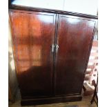 A mahogany two door compendium by Compactum of London,