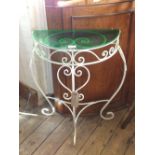 A painted iron half moon hall table with green glass top