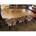 An Ercol dining table plus six chairs