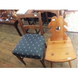 An Edwardian mahogany shaped top table plus four various chairs