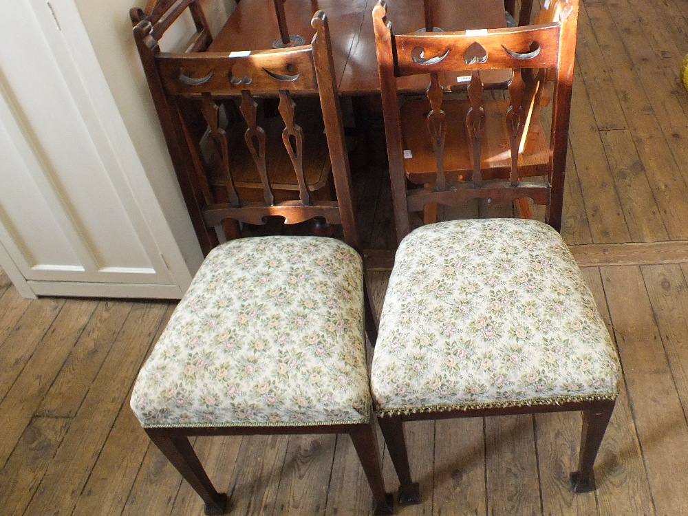 A set of four Art Nouveau mahogany dining chairs