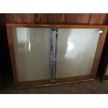 A wall hanging glazed display cabinet