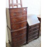 A reproduction mahogany chest on chest,