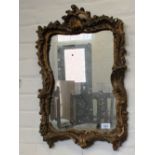 A 19th Century gilt wall mirror with shell decoration