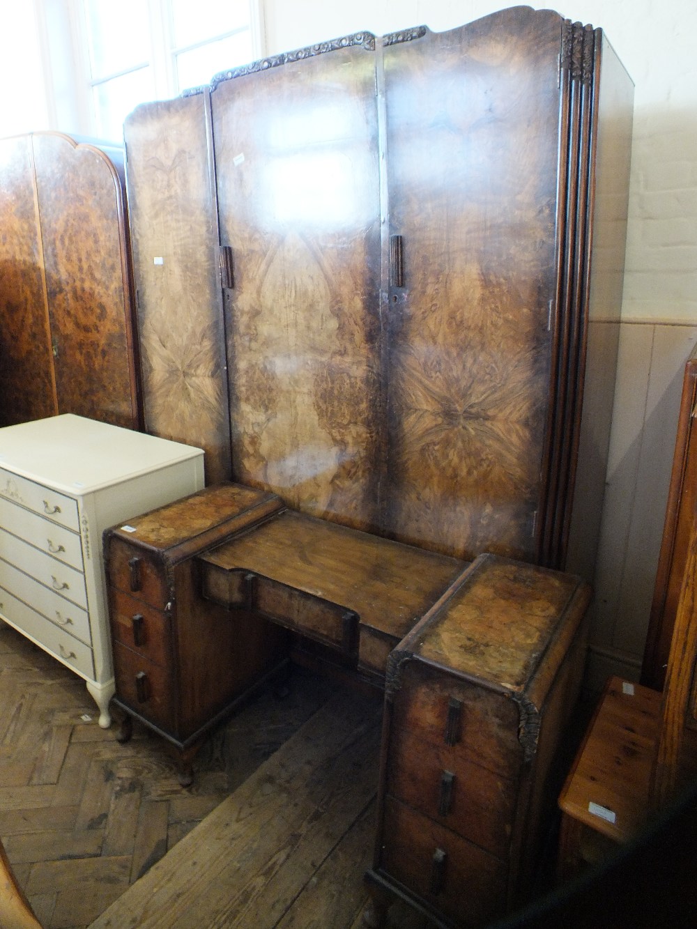 A 1930's walnut wardrobe and dressing table