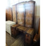 A 1930's walnut wardrobe and dressing table