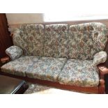 A modern floral upholstered three piece suite