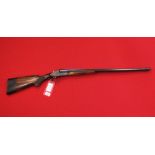 A Baikal 12 bore 'Deluxe' S/S B.L.E. shotgun in overall good condition with fire bores, S/No.