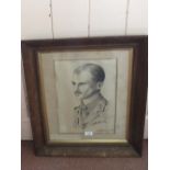 A charcoal drawing of a Royal Artillery Officer signed and dated 2/1/19 with a Lancaster print