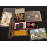 A mixed lot including a tin of badges,