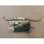 A carbon fibre laminate bow with arrows and a box of accessories etc