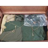 A mixed lot of mainly Royal Naval and 'Marine' uniforms etc within a vintage case