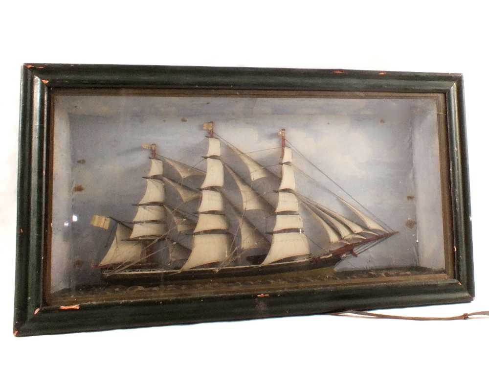 A model of a sailing ship in glazed case